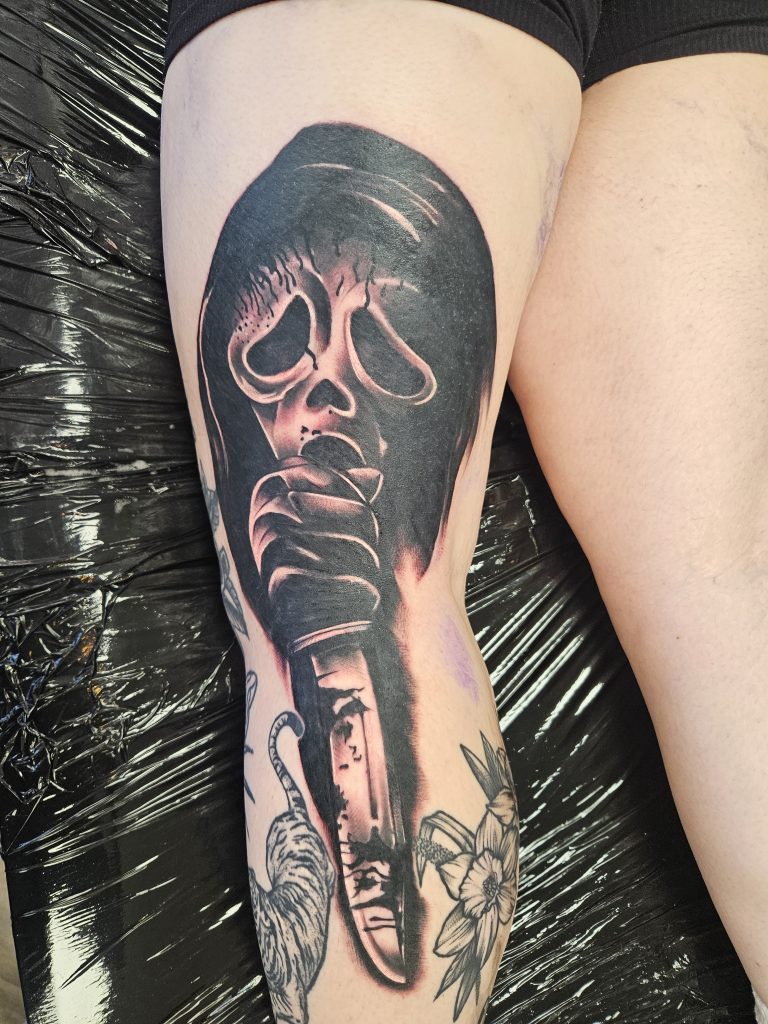 Black and grey tattoo by Wayne Goodwin